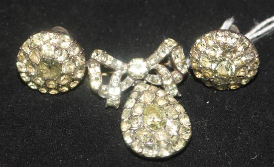 A 19th century paste and gem set silver demi parure, comprising a brooch and pair of ear clips.